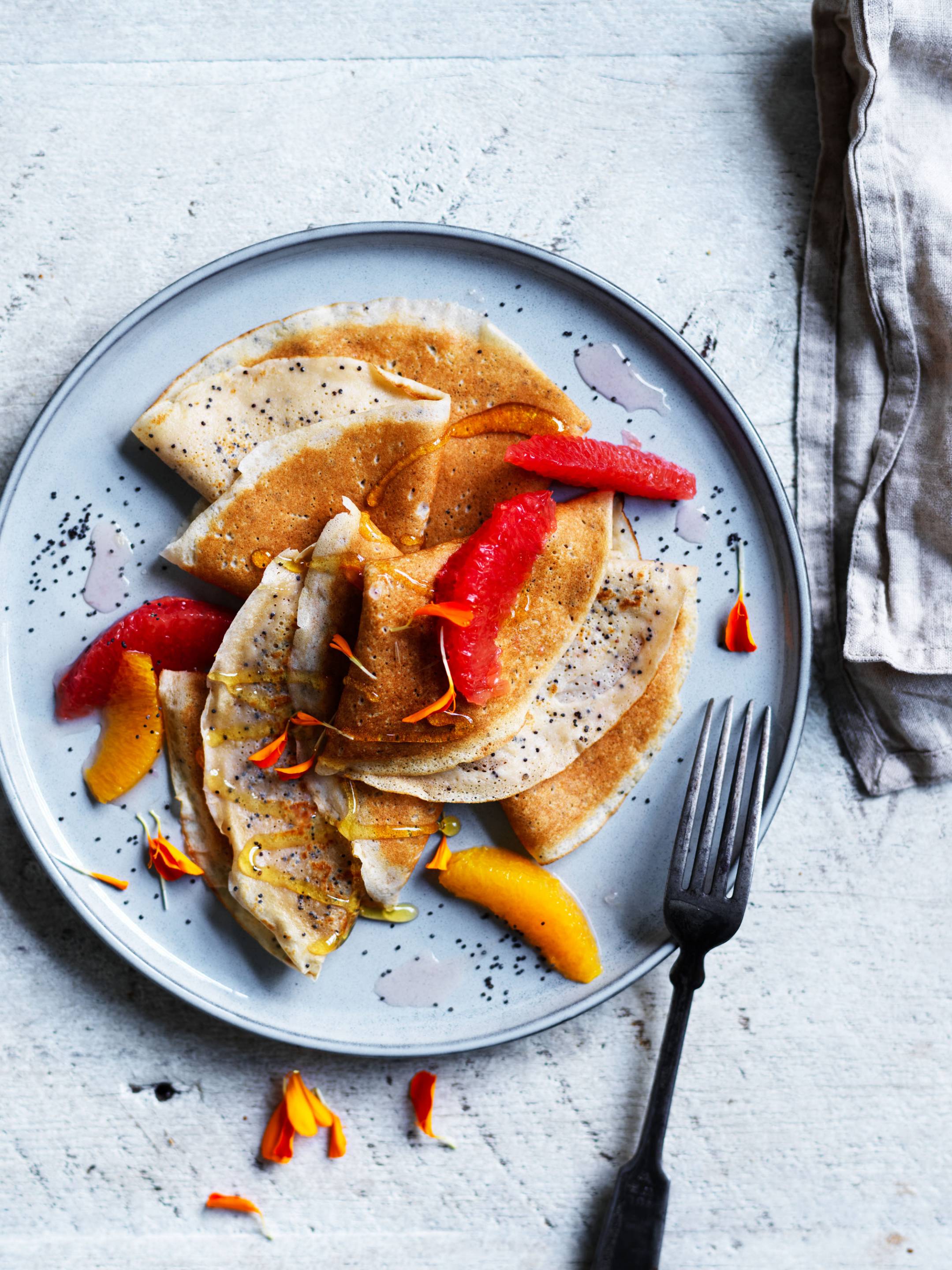poppyseed crepes with citrus fruits
